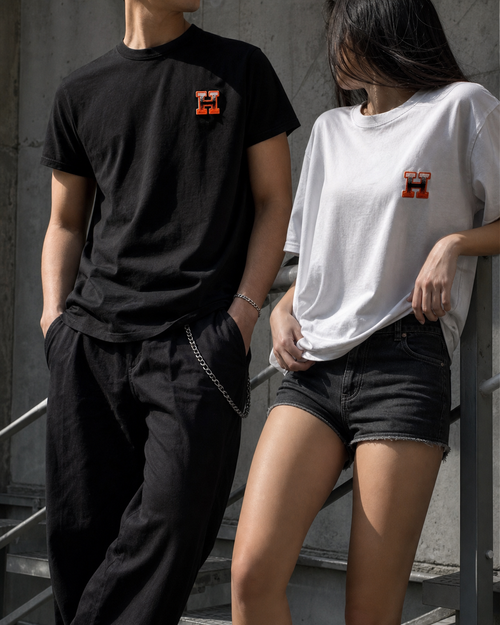 Models wearing black and white H logo T-shirts